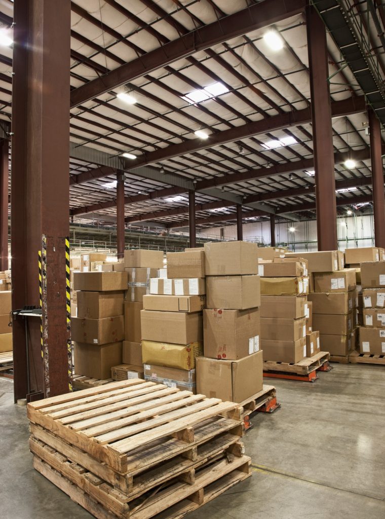 Cardboard boxes and pallets in warehouse Cardboard boxes and pallets in warehouse