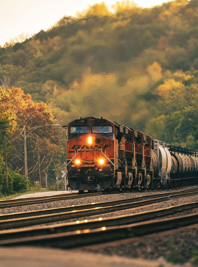 Freight train in scenic autumn landscape Freight train in scenic autumn landscape