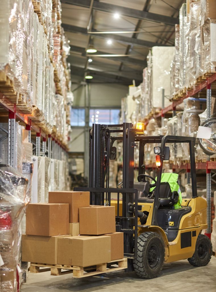 Vertical background image of forklift truck carrying boxes in warehouse Vertical background image of forklift truck carrying boxes in warehouse